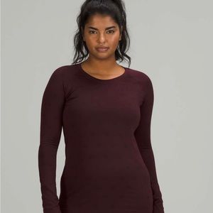 lululemon swiftly tech long sleeve shirt in maroon with lululemon circles on it